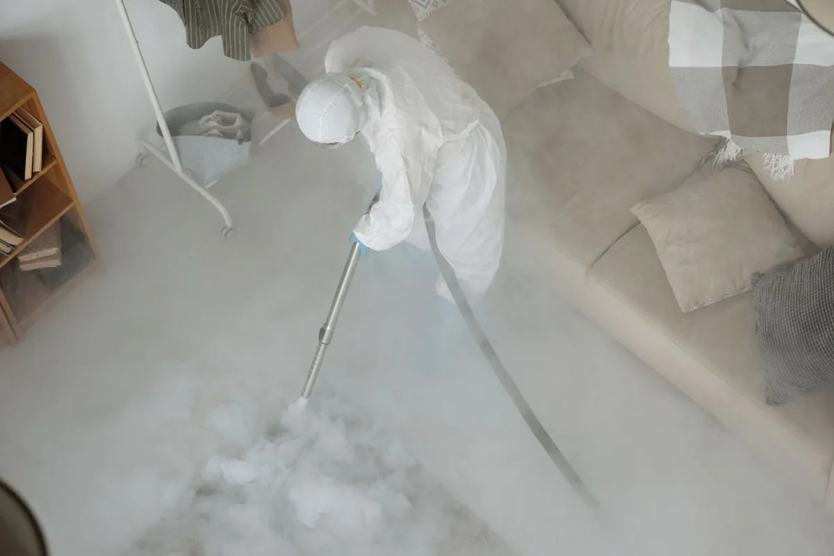 Biohazard cleanup technician in protective equipment, Central Oak Park, St. Petersburg, FL